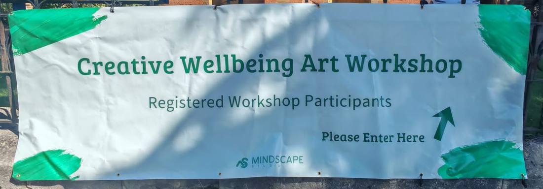 A Mindscape Studio banner outside a hall reading Creative Wellbeing Art Workshop, Registered Workshop Participants, Please Enter Here
